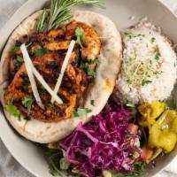 Chicken Kabob · Marinated chicken served over pita with rice and chopped salad. Tahini sauce on the side.