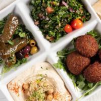Vegetarian Platter · Falafel/ Hummus/ Tabouli/ Stuffed Grapes Leaves. Served with pita and tahini on the side.