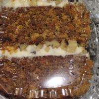 Carrot Slice · CARROT CAKE WITH CREAM CHEESE FROSTING AND FILLING. NUTS AND RAISINS IN THE FROSTING AND FIL...