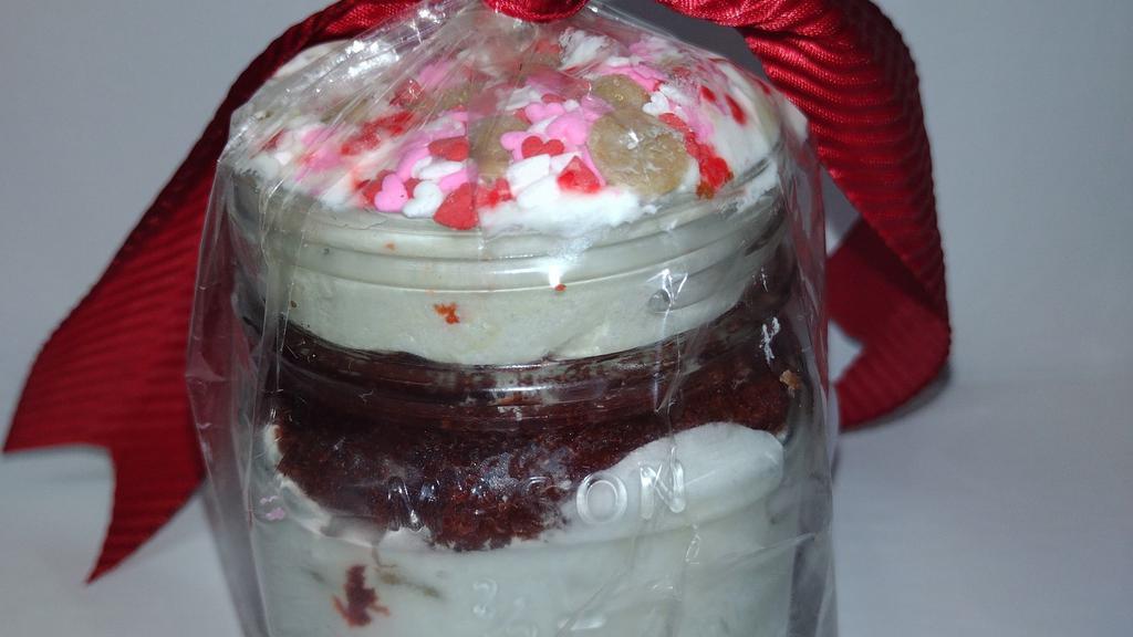 Red Velvet Cake Jar · White Chocolate Mousse with Red Velvet Cake sprinkled with White Chocolate and Carmel Morsels