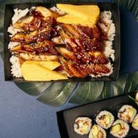 Unagi Don · grilled freshwater eel on a bed of white rice garnished with sesame seed, tamago, and daikon...