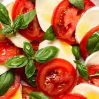 Caprese · Tomato, fresh mozzarella , oregano, basil, extra virgin olive oil.