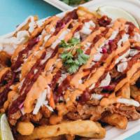 Pulled Pork Fries · Extra crispy french fries topped with house-marinated vegan chicken smothered in our house b...