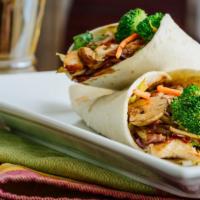 Ya Mann Wrap · Spicy, smokey and tender jerk chicken, topped with red onions, jalapeños, romaine lettuce, a...