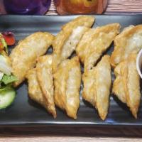 Homemade Fried Dumplings (8 Pieces) · Pork or shrimp or vegetable with salad.