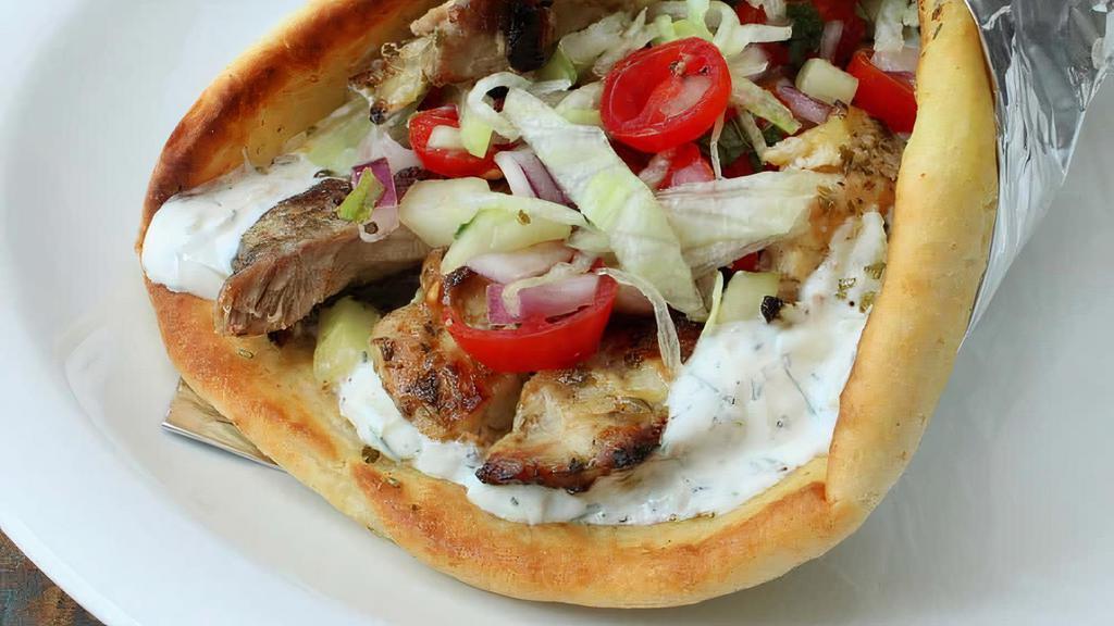 Chicken Gyro · Halal, spicy. Halal chicken cooked with delicious flavors served in a fresh pita bread with  your choice of white sauce, hot sauce and salad.