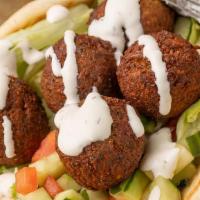 Falafel Gyro · Halal, spicy. Delicious Falafel, served in a fresh pita bread, with your choice of white sau...
