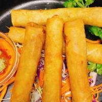 2) Spring Roll · A delicate combination of fresh veggies, grass noodles mixed with Thai herbs wrapped in a th...