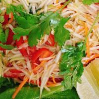 15) Som Tum (Papaya Salad) · Fresh shredded green papaya with tomato, green bean, garlic in a spicy homemade tamarind jui...