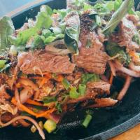 17) Nam Tok Beef (New York Steak), Chicken Or Pork · Grilled beef or pork mixed with onion, green onion, cilantro, carrot, ground roasted rice in...