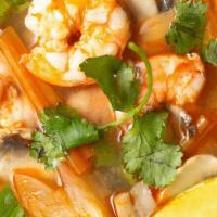 21) Tom Yum Soup (Hot And Sour Soup) · A spicy and sour mixture with Thai herbs, onion, tomato, carrot, mushroom, onion, and cilant...
