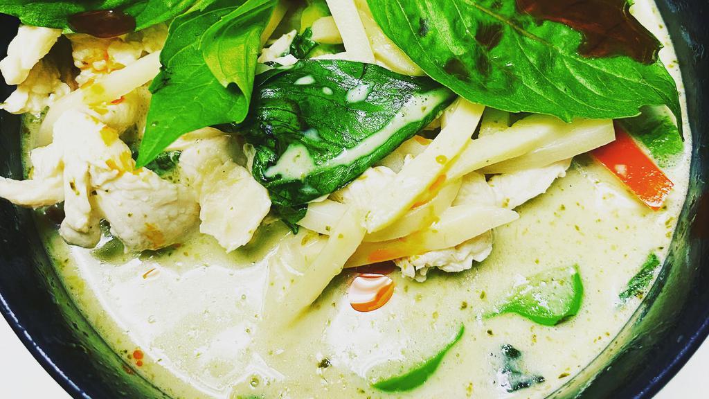 33) Green Curry · Green curry cooked with coconut milk, bamboo shoots, bell pepper, eggplant, and basil.