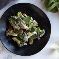 Broccoli Con Ajo Blanco · Roasted broccoli, Marcona almond ajo blanco, sumac, raisins, mint