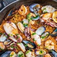 Paella De Mariscos (Medium) · Bomba rice, monkfish, sepia, squid, shrimp, clams, mussels, saffron, salsa verde. PLEASE NOT...