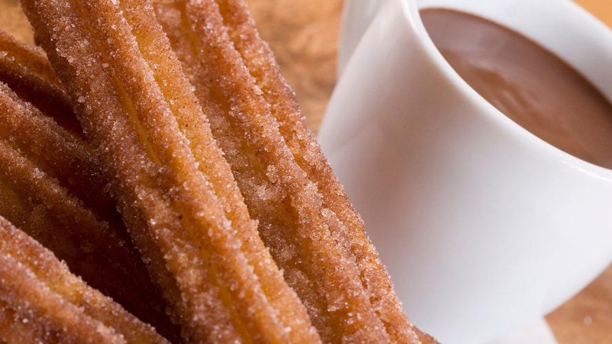 Churros Con Chocolate · Five pieces. Traditional fried dough dusted with cinnamon sugar and served with thick hot chocolate.