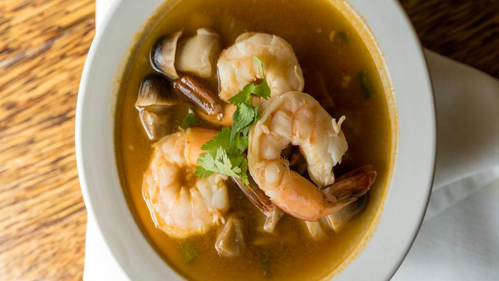 Seafood Lemongrass Soup · Tom yum. A combination of lemon grass, lime leaves, mushrooms, green onions, cilantro, herbs, and spices in a clear broth.