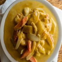 Yellow Curry · Yellow chili cooked with potatoes, carrots, round onions, coconut milk, and Thai spices. Ric...