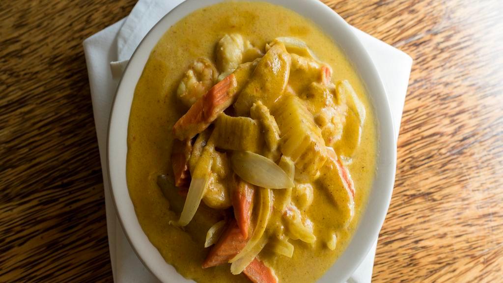 Yellow Curry · Yellow chili cooked with potatoes, carrots, round onions, coconut milk, and Thai spices. Rice not included.