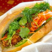 Fish Fry Bánh Mì  · crispy wild perc  with mayo, cucumber, cilantro, jalapenos, pickled carrots, and daikon. ser...