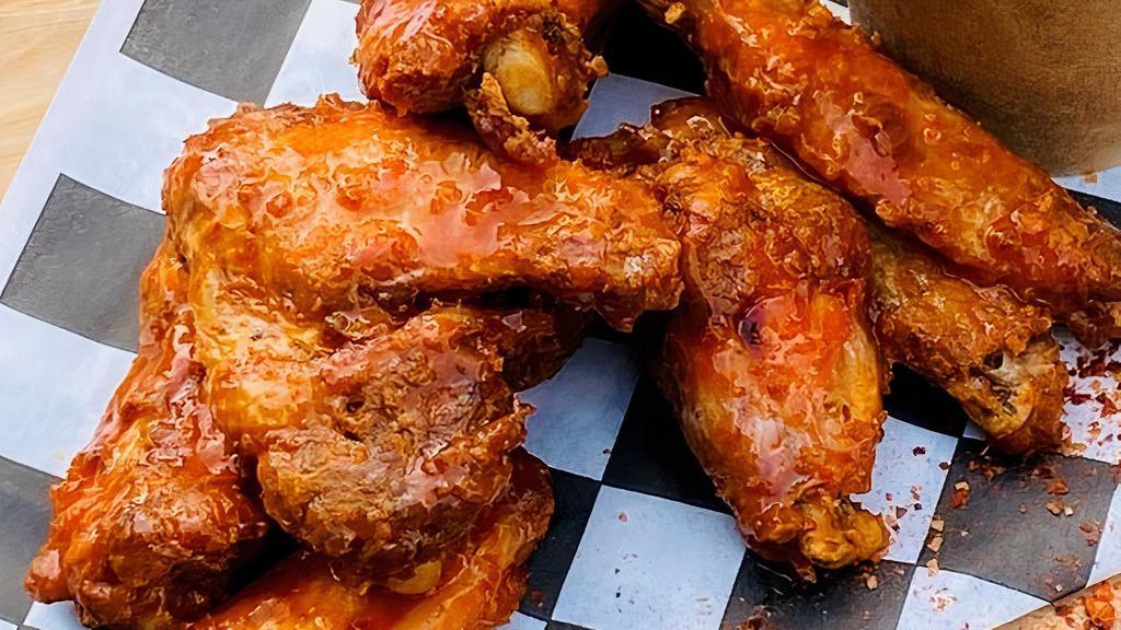 Buffalo Chicken Wings · Perfectly cooked chicken wings slathered in a spicy buffalo sauce.