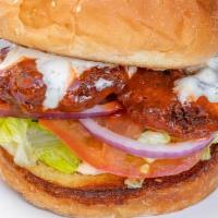 Buffalo Chicken Sandwich · Crispy Buffalo chicken with lettuce, tomato, onion, and pickles on a classic bun.