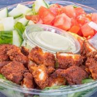 Crispy Chicken Salad · Crispy cornflake chicken served on a bed of romaine, tomato, and cucumbers with choice of dr...
