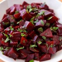 Beet Salad · A bed of cool, sautéed beets tossed with parsley, red onions, and a pinch of black pepper.