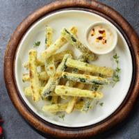 Crunchy Zucchini Fingers · Zucchini sticks dipped in an egg mixture with bread crumbs, parmesan cheese, baking powder a...