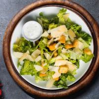 Let Caesar Hold Your Salad · Crispy romaine tossed with croutons, Caesar dressing, and grated cheese.