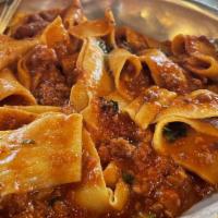 Pappardelle Alla Bolognese · Housemade ribbon pasta, meat sauce.
