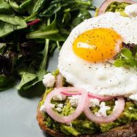 Breakfast Avocado Toast · Organic sunny side up egg on Balthazar sour dough, with avocado mash, goat cheese, pickled s...