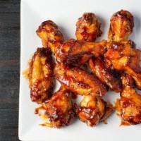 Bbq Chicken Wings · Fresh oven-baked chicken wings smothered in sweet tangy barbeque sauce. Served with celery a...