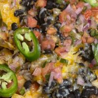 Nachos  · Melted cheddar, jalapeños, black beans, sour cream and pico de gallo