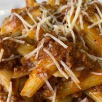 Bolognese  · Tradicional slow cooked bolognese sauce, Parmesan Cheese over fettuccini