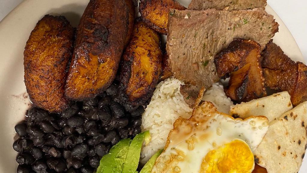 Bandeja Paisa · Grilled steak, chorizo, rice, beans, egg, fried plantain, avocado, arepas and fried pork belly