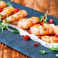 Crevettes A L'Aioli · Grilled shrimps, Provence herbs, sun-dried tomatoes, tarragon aïoli. Gluten Free. Contains N...