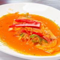 Sudado De Pescado · Fish fillet stew with sliced onions, peppers and tomatoes.
