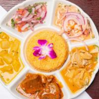 Bandera · Goat stew, tripe, tuna fish with cassava and shrimp ceviche and served with rice.