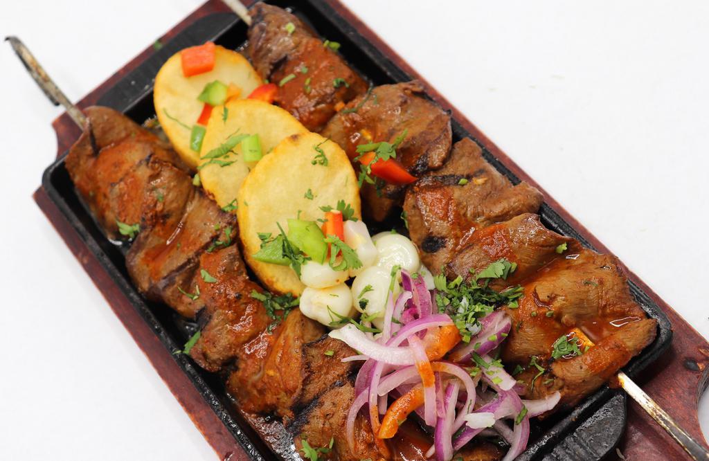 Anticucho · Grilled skewer marinated in house special sauce.