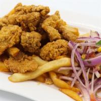 Chicharron De Pollo · Fried chicken served with French fries.