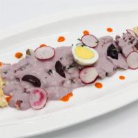 Pulpo Al Olivo · Sautéed sliced octopus topped with house special olive sauce.
