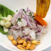 Ceviche De Corvina · Fresh cubes of corvina, marinated in fresh lime juice and Peruvian spices. Served with sweet...