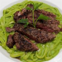 Fettuccine Al Pesto Medallion · Grilled filet mignon with red wine reduction sauce.