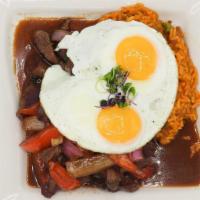 Tacu Tacu · Peruvian style rice and beans risotto, sautéed filet mignon, and fried egg.