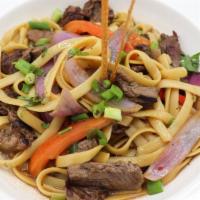 Tallarin Saltado · Peruvian style fettuccine sautéed with tomatoes, onions, soy sauce, and choice of meat.