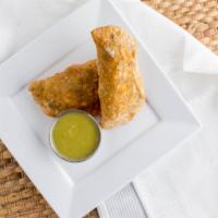 Empanadas · Flour dough discs folded over with choice of chicken or steak filled with melted cheese.