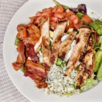 Cobb Salad · Chopped salad greens, tomato, crispy bacon, grilled chicken breast, hard boiled egg, avocado...