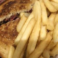 Reuben Sandwich · Grilled corned beef, sauerkraut, Swiss cheese, and Rusian dressing on rye bread, with colesl...