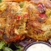 Cornbread Crab Cake · With lemon-caper sauce. Prepared with lump crabmeat, green onions, red and green peppers, ma...