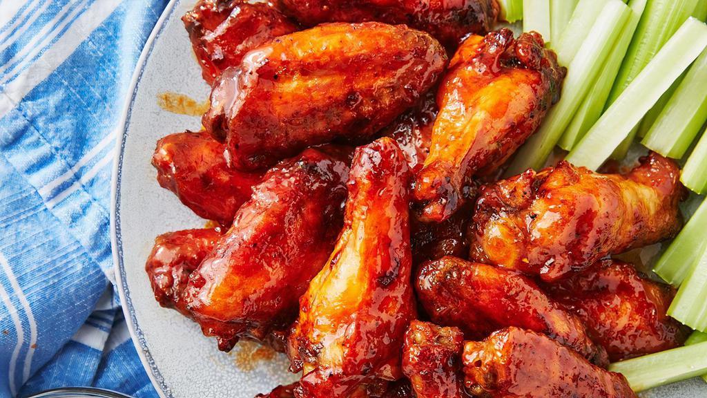 7 Pieces Buffalo Chicken Wings · A Buffalo wing in American cuisine is an unbreaded chicken wing section that is generally deep-fried and then coated or dipped in a sauce consisting of a vinegar-based cayenne pepper hot sauce and melted butter prior to serving.